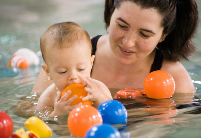 Swimming with a baby. Image: ©iStock.com/Brian McEntire