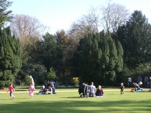 Families have a picnic at Anglesey Abbey.